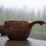 a couple of brown cups sitting on top of a table